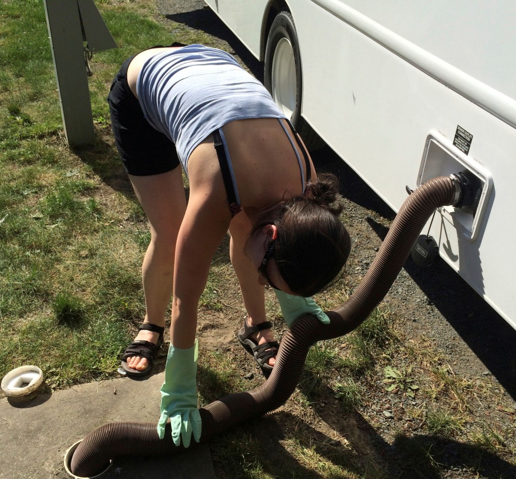 Young woman hooking up an RV 