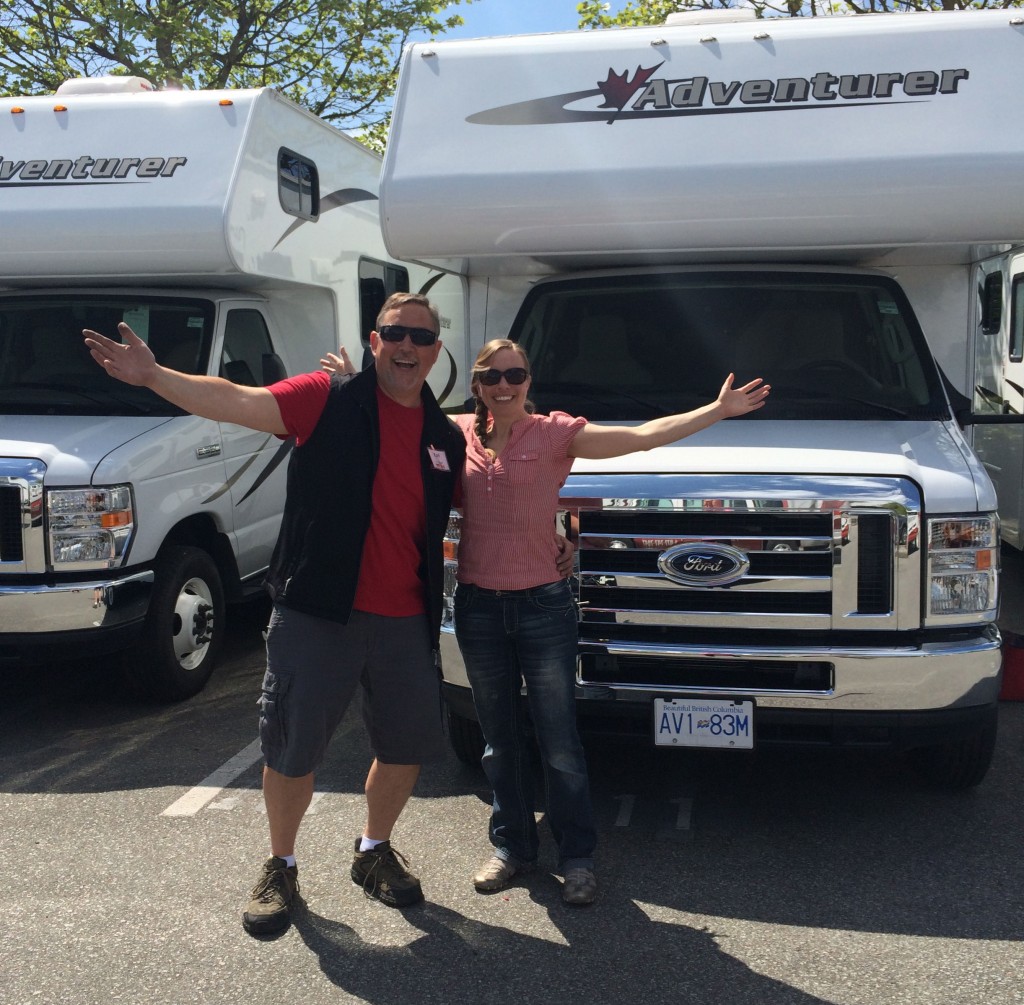 Woman and man standing in front of an RV 
