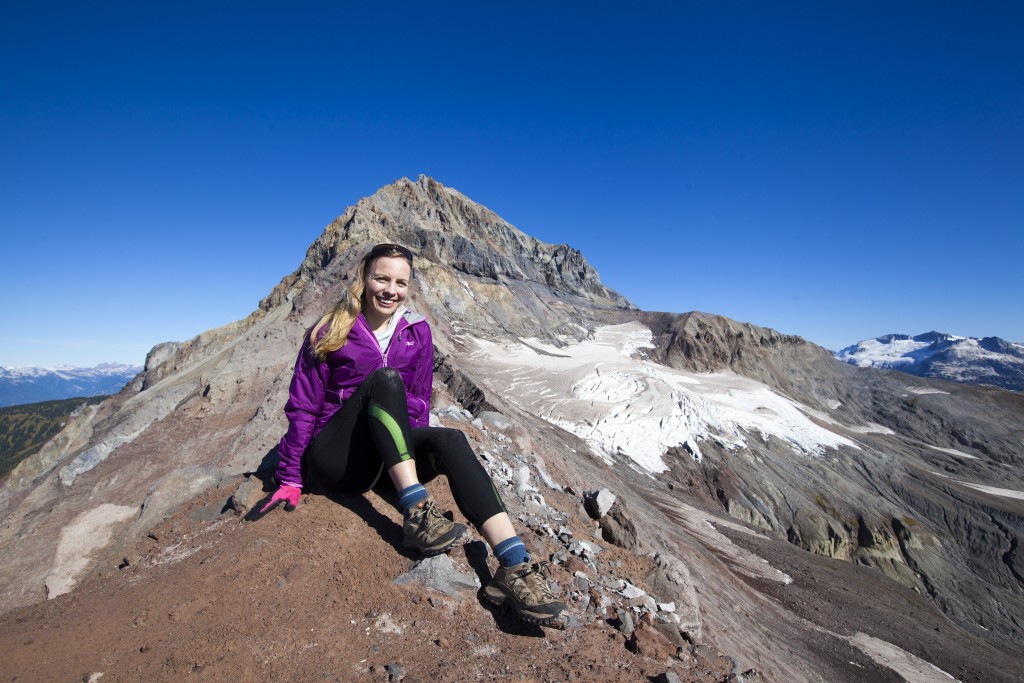 woman sitting on rock 