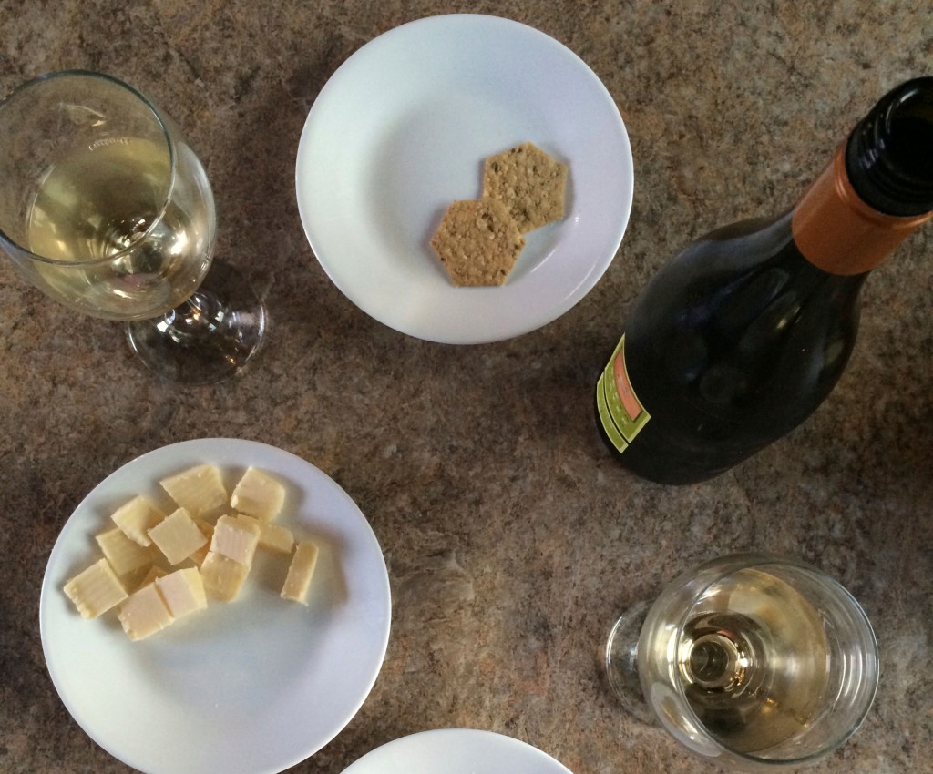 A picture of wine and cheese